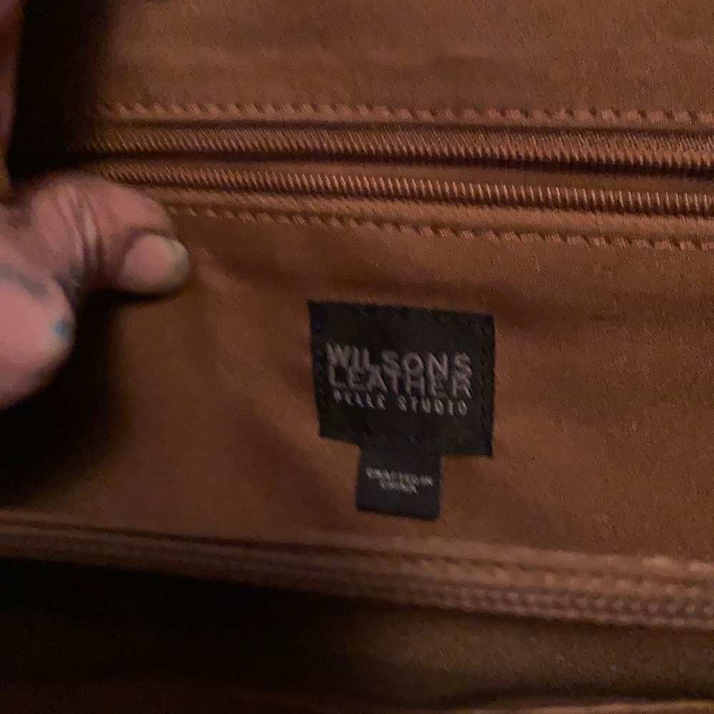 A stunningly rich dark red Brick leather pelle studios case can b used fr laptop